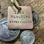 1949 Plymouth Super Deluxe Solid Brass Key Fob. Fixed Price $14.95.